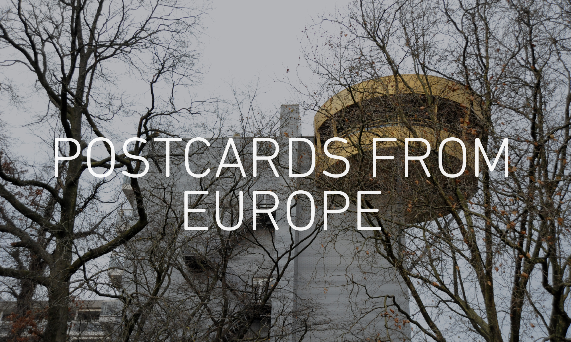 Graphic with an image of a building and trees in the background, with the words 'POSTCARDS FROM EUROPE' overlaid in white in the centre.
