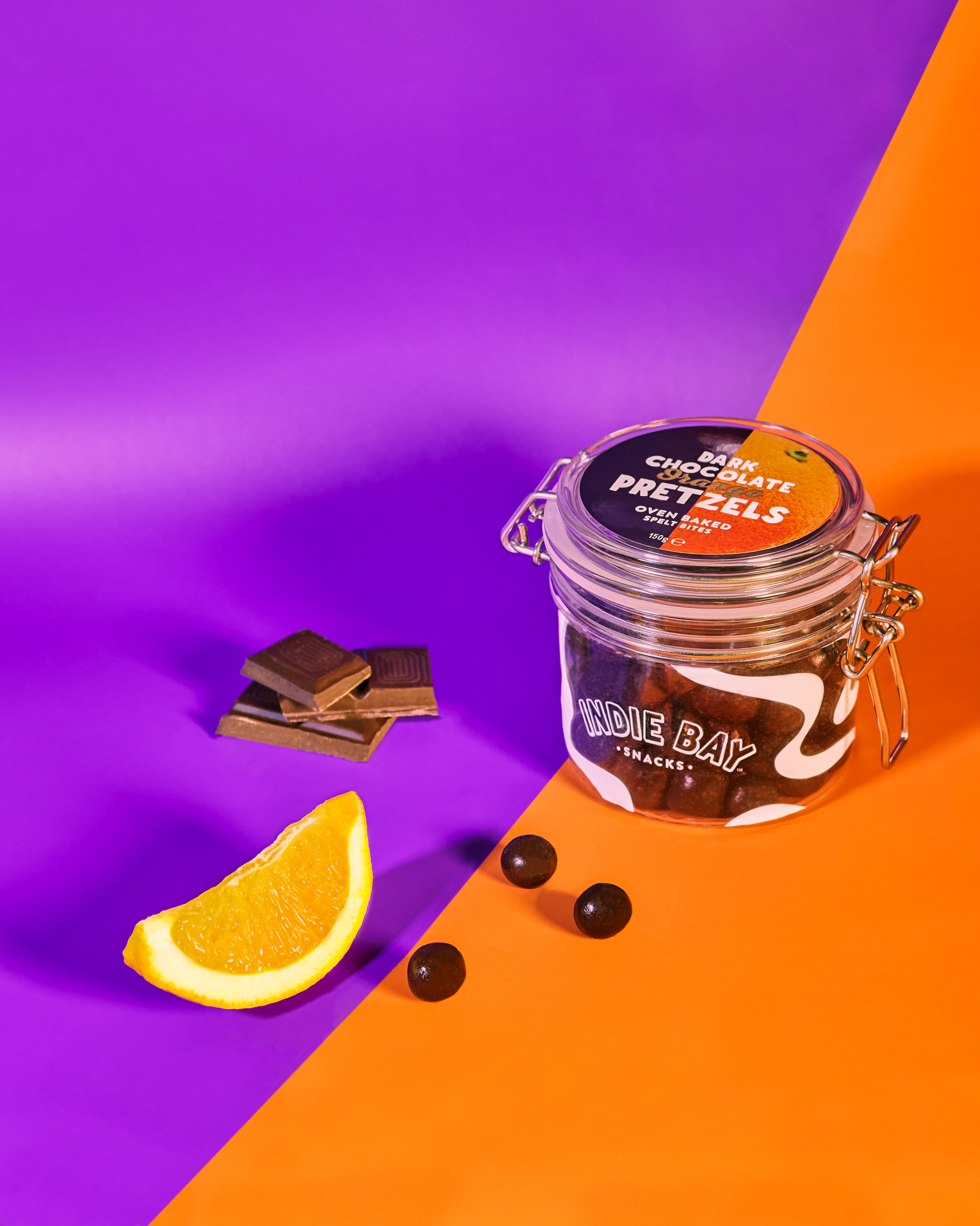jar with cookies on an orange and purple background